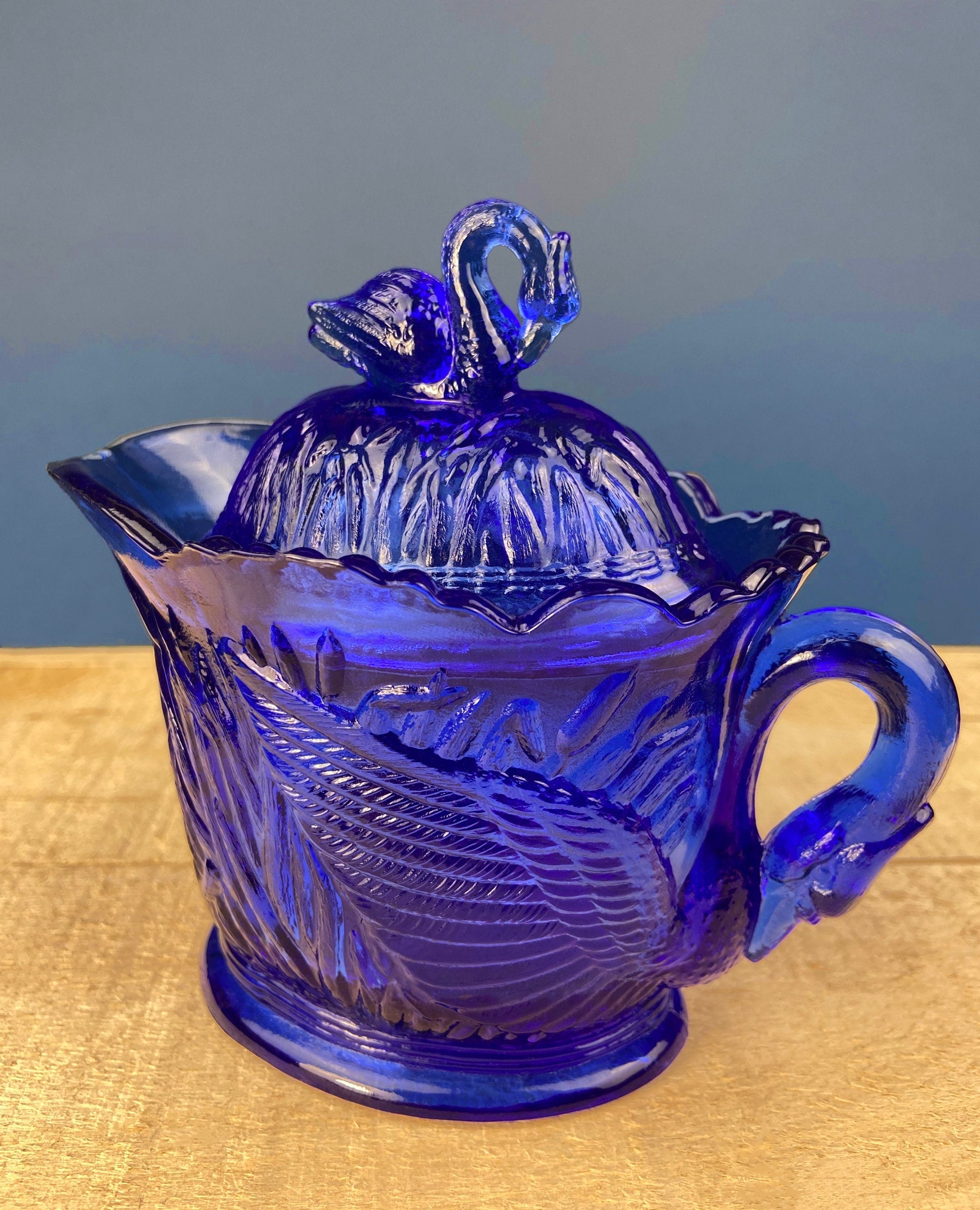 Cobalt Blue Creamer with Swan-Shaped Handle and Lid. Glass Creamer with Embossed Reed and Swans. Collectible Glass.